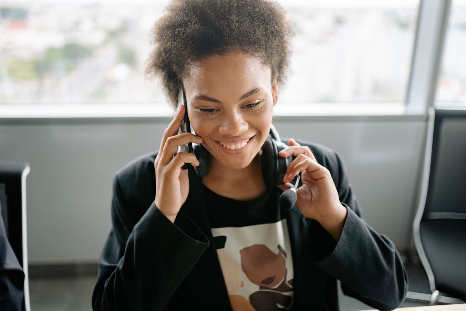 A smiling support consultant on the phone